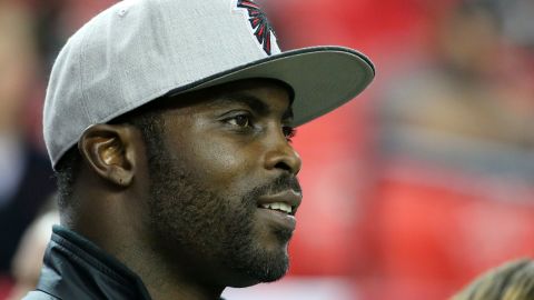 Former Atlanta Falcons player Michael Vick stands on the field prior to the game against the New Orleans Saints at the Georgia Dome on January 1, 2017 in Atlanta, Georgia.