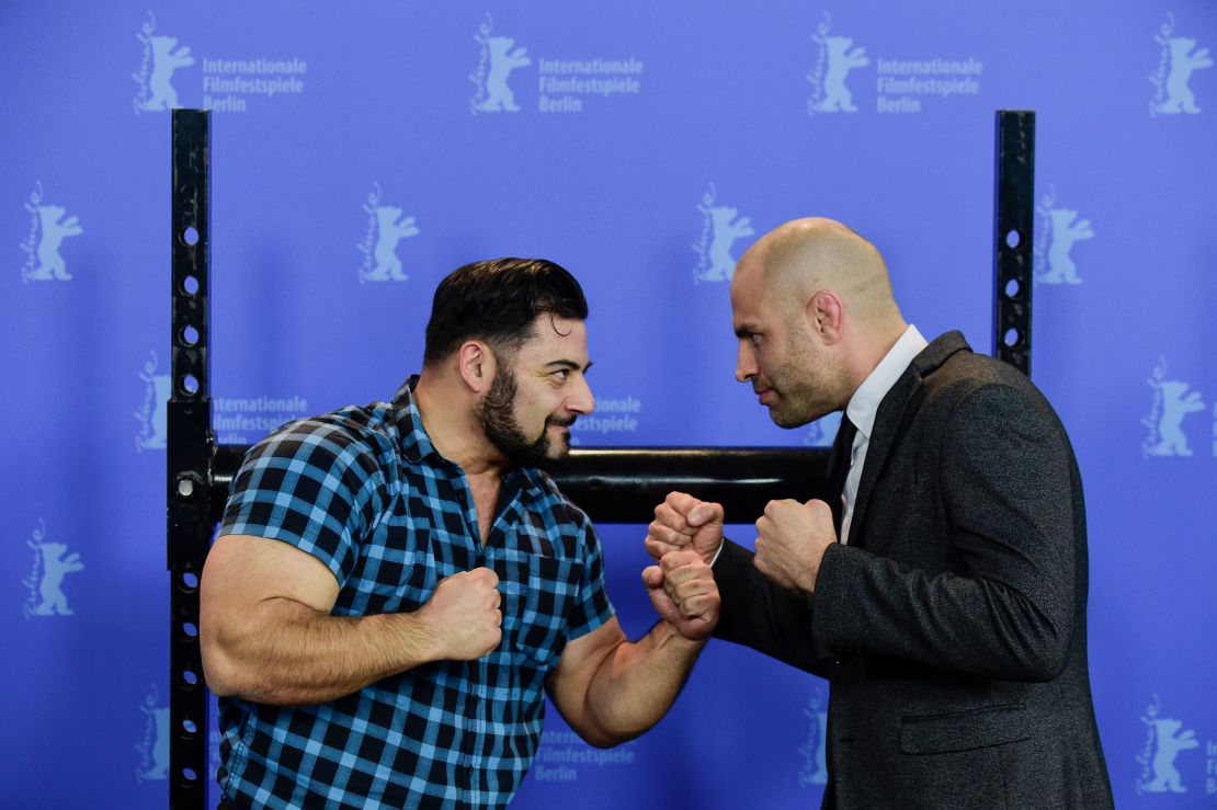 James Wilks (right) poses with German strongman Patrik Baboumian (left) who is a protagonist in "The Game Changers" and speaks of his improved performance since transitioning to a plant-based diet.  