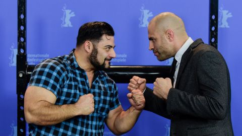 James Wilks (right) poses with German strongman Patrik Baboumian (left) who is a protagonist in "The Game Changers" and speaks of his improved performance since transitioning to a plant-based diet.
