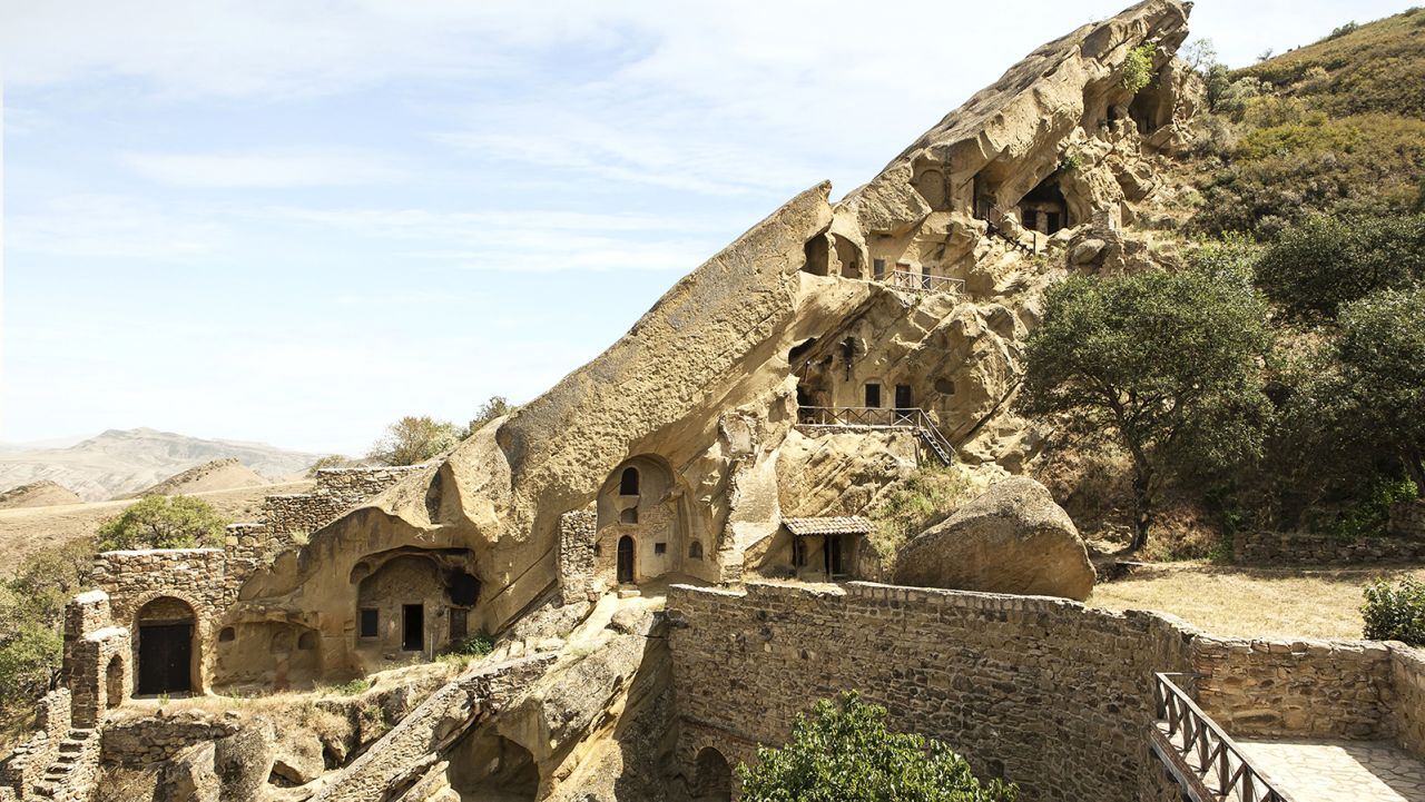 This monastery cave complex features nearly 30 frescoed monasteries carved into sandstone.