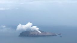 The White Island volcano seen billowing a stream of white smoke on December 12.