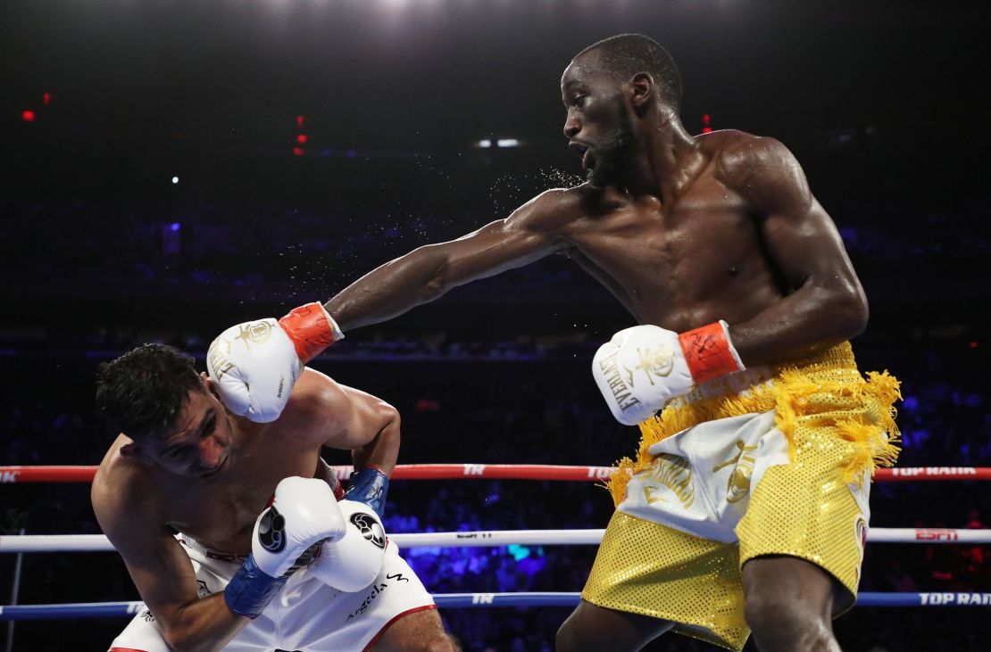Terence Crawford punches Amir Khan during their WBO welterweight title fight at Madison Square Garden on April 20, 2019 in New York City. 