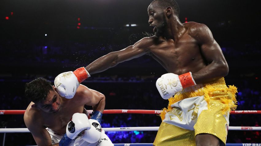 NEW YORK, NEW YORK - APRIL 20:  Terence Crawford punches Amir Khan  during their WBO welterweight title fight at Madison Square Garden on April 20, 2019 in New York City. (Photo by Al Bello/Getty Images)