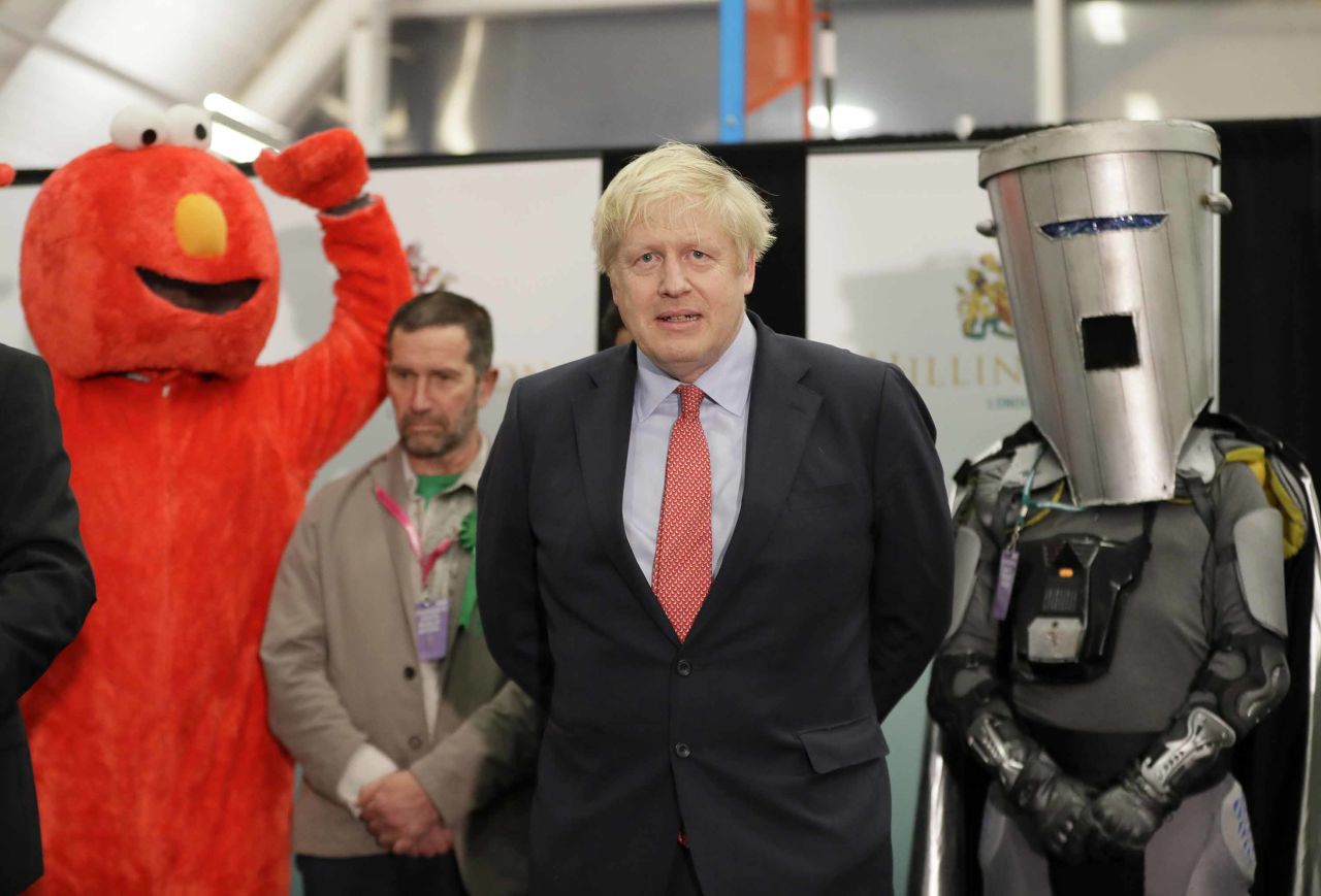 Johnson appears on stage alongside Bobby Smith during the count declaration in London in December 2019. <a href="https://edition.cnn.com/2019/12/13/uk/uk-election-boris-johnson-win-ge19-intl-gbr/index.html" target="_blank">Johnson's Conservative Party won a majority</a> in the UK's general election, securing his position as Prime Minister.