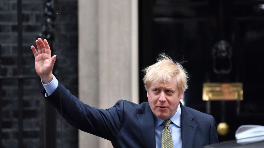 Britain's Prime Minister and Conservative Party leader Boris Johnson waves as he leaves 10 Downing Street in central London on December 13, 2019, for an audience with Britain's Queen Elizabeth II at Buckingham Palace, where she will invite him to become Prime Minister and form a new government. - Conservative Prime Minister Boris Johnson on Friday hailed a political "earthquake" in Britain after a thumping election victory which clears the way for the country to finally leave the EU next month after years of paralysing deadlock. (Photo by Ben STANSALL / AFP) (Photo by BEN STANSALL/AFP via Getty Images)