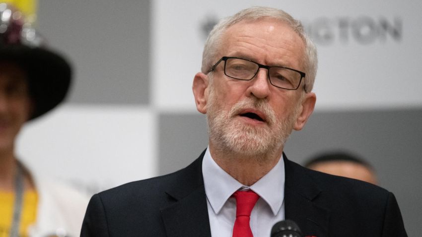 LONDON, ENGLAND - DECEMBER 13: Labour Party leader Jeremy Corbyn (R) addresses the media and supporters at Sobell leisure centre after retaining his parliamentary seat on December 13, 2019 in London, England. Labour leader Jeremy Corbyn has held the Islington North seat since 1983. The current Conservative Prime Minister Boris Johnson called the first UK winter election for nearly a century in an attempt to gain a working majority to break the parliamentary deadlock over Brexit. The election results from across the country are being counted overnight and an overall result is expected in the early hours of Friday morning. (Photo by Leon Neal/Getty Images)