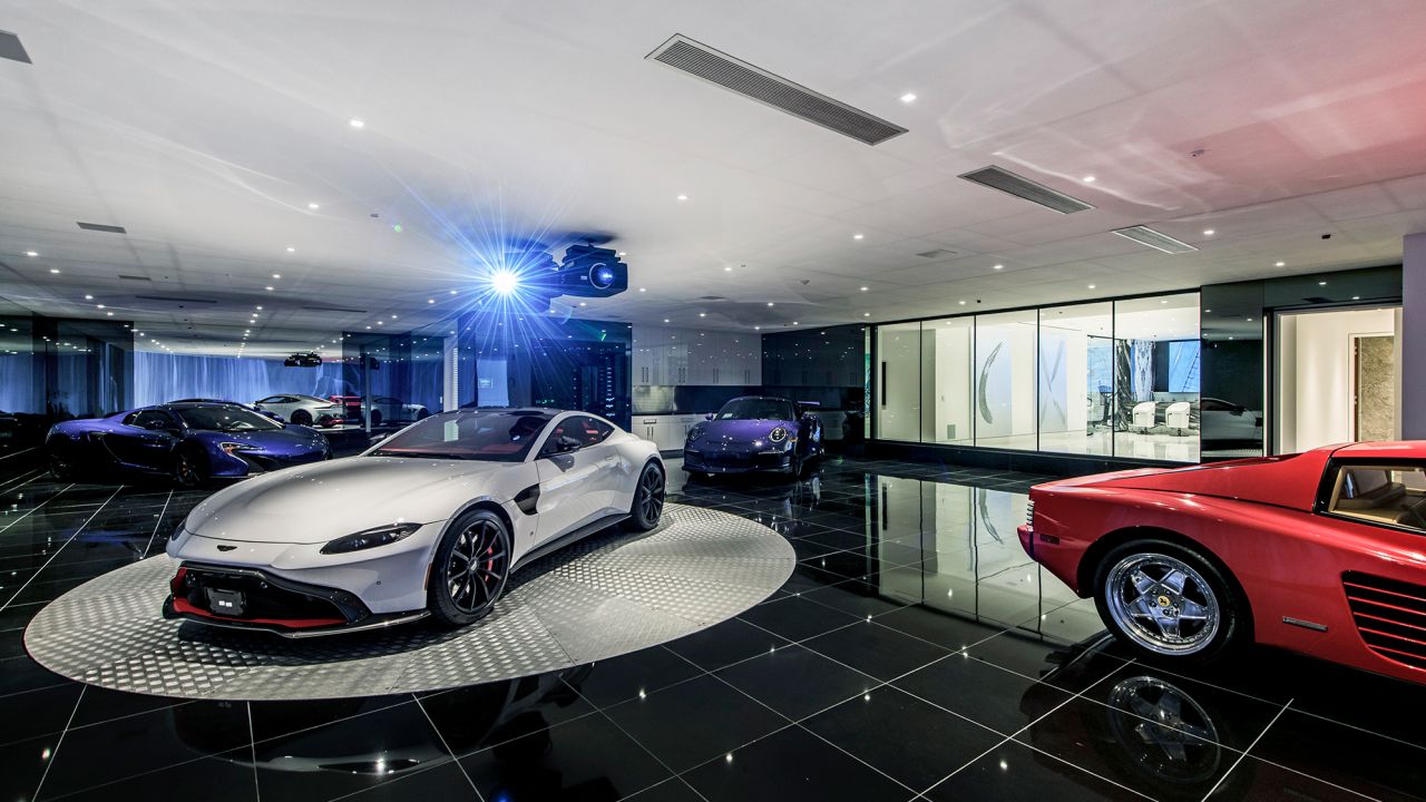 The underground car gallery at this Beverly Hills home can house 7 cars and is adjacent to a lounge.