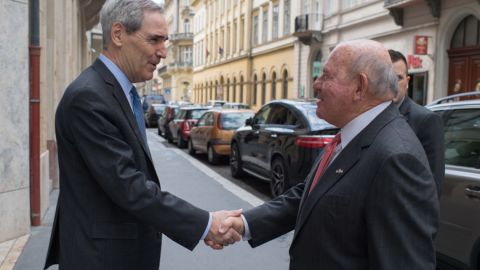 Michael Ignatieff, president and rector of Central European University, greets Ambassador David Cornstein in 2018.