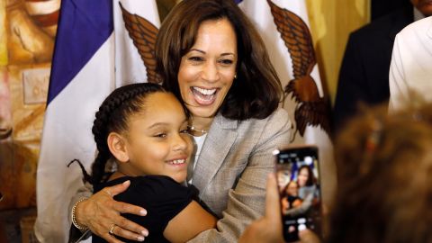 Kamala Harris gets a hug from Kyrah Cortimiglia, of San Diego, California, following a Women of Color roundtable discussion, in July 2019, in Davenport, Iowa. 
