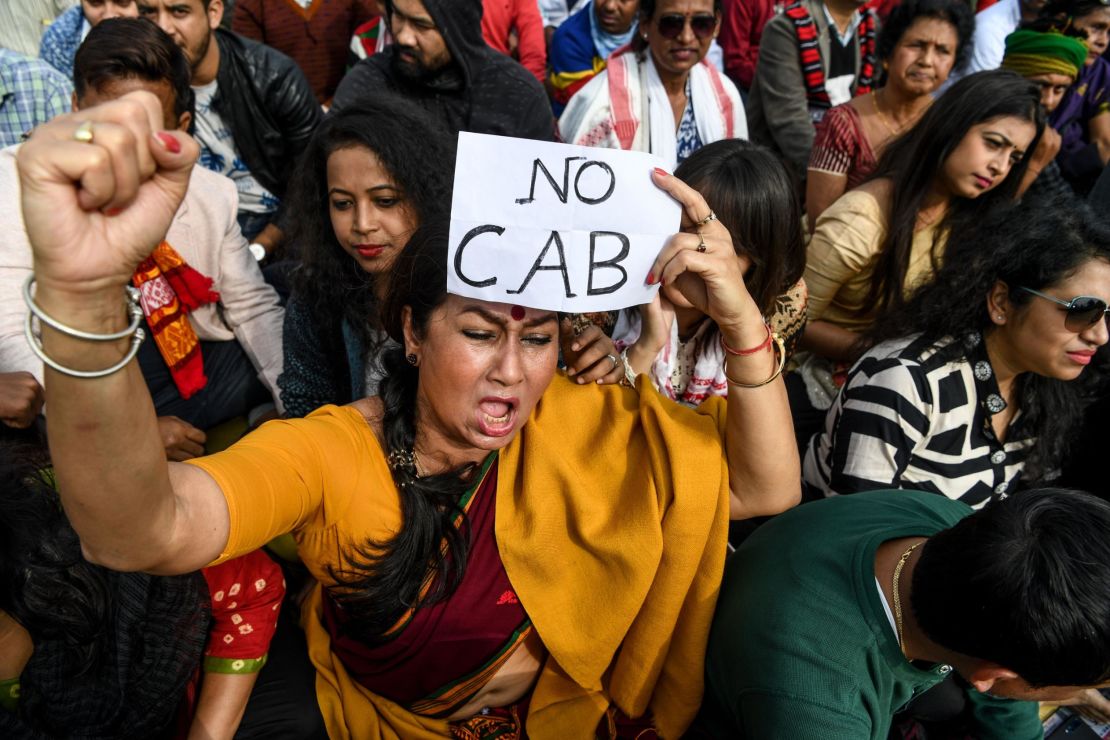 Demonstrators shout slogans during a protest against the government's Citizenship Amendment Bill (CAB) in Guwahati on December 13, 2019. 