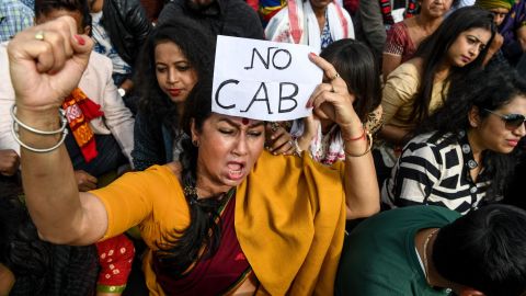 Demonstrators shout slogans during a protest against the government's Citizenship Amendment Bill (CAB) in Guwahati on December 13, 2019. 