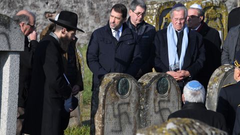 French Interior Minister Christophe Castaner, center, visits the Jewish cemetery at Westhoffen after the attack this month.