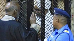 Sudan's deposed military president Omar al-Bashir sits in a defendant's cage during his corruption trial at a court in Khartoum on December 14, 2019. - A Sudanese court  ordered former president Omar al-Bashir to be detained for two years in a correctional centre for corruption in one of several cases against the ousted autocrat. Bashir, who was toppled by the army in April after months of mass demonstrations, was convicted of graft and "possession of foreign currency", judge Al Sadiq Abdelrahman said. (Photo by - / AFP) (Photo by -/AFP via Getty Images)