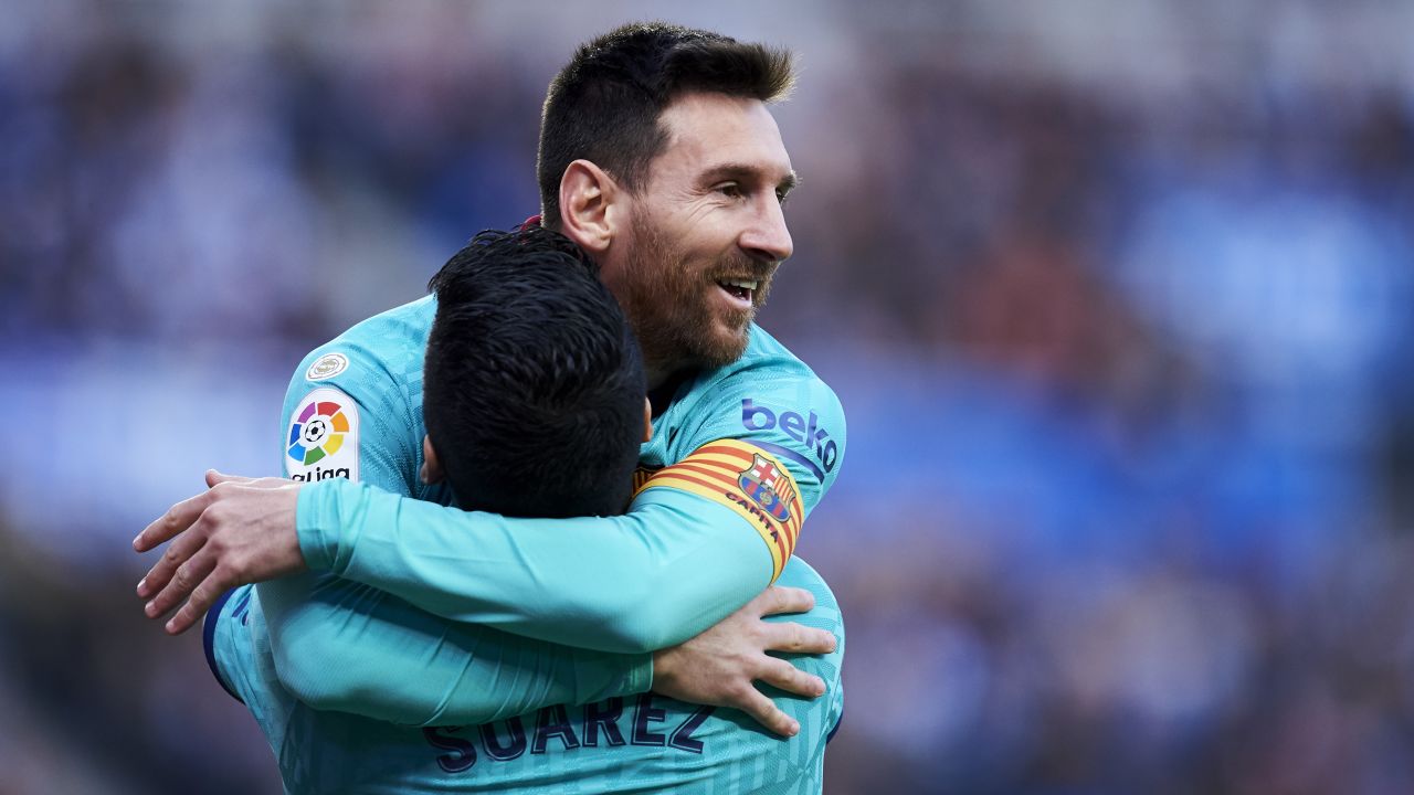 Luis Suarez celebrates his goal with teammate Lionel Messi.