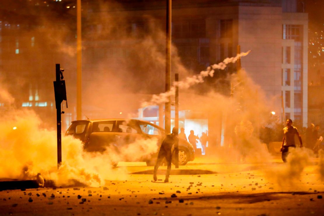 Lebanese demonstrators battle riot police in Beirut on Saturday.