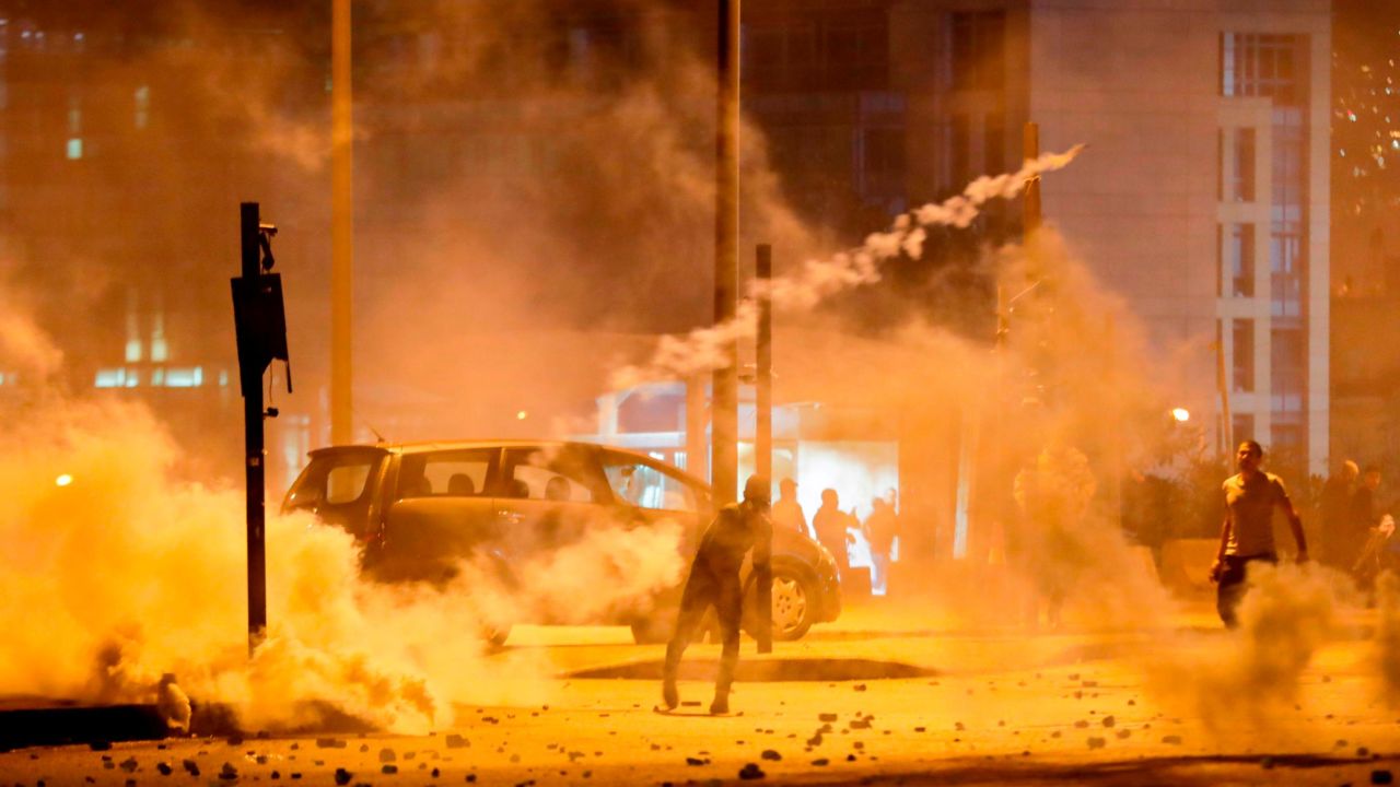 Lebanese demonstrators battle riot police in Beirut on Saturday.