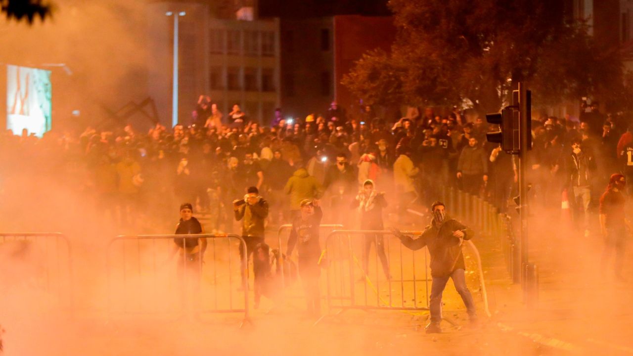 Lebanese demonstrators hurl rocks at riot police on Saturday night.