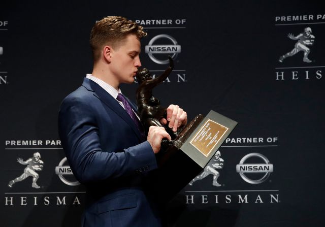 Louisiana State University quarterback Joe Burrow poses for a photo after winning the Heisman Memorial Trophy on Saturday, December 14, in New York. Burrow is the<a href="index.php?page=&url=https%3A%2F%2Fwww.cnn.com%2F2019%2F12%2F14%2Fus%2Fheisman-trophy-winner-2019%2Findex.html" target="_blank"> second player in LSU history </a>to win the Heisman.