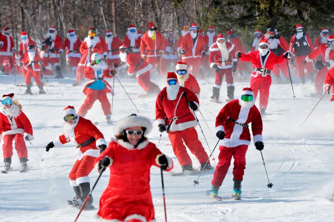 Skiers dressed as Santa Clause participate in the annual Santa Sunday charity fundraiser skiing event in Newry, Maine, on Sunday, December 8. According to the registration website, the money raised supported the River Fund, a non-profit organization that supports youth education and recreation. 