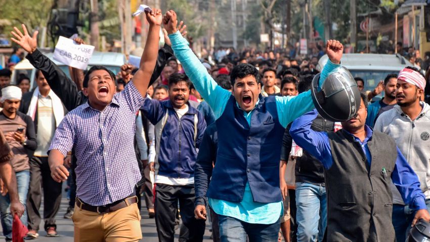 Demonstrators shout slogans during a protest against the government's Citizenship Amendment Bill (CAB) in Guwahati on December 12, 2019. - Indian police fired blanks on December 12 as thousands of protesters ignored a curfew in the north-east of the country, in a fresh day of demonstrations against contentious new citizenship legislation. (Photo by Biju BORO / AFP) (Photo by BIJU BORO/AFP via Getty Images)