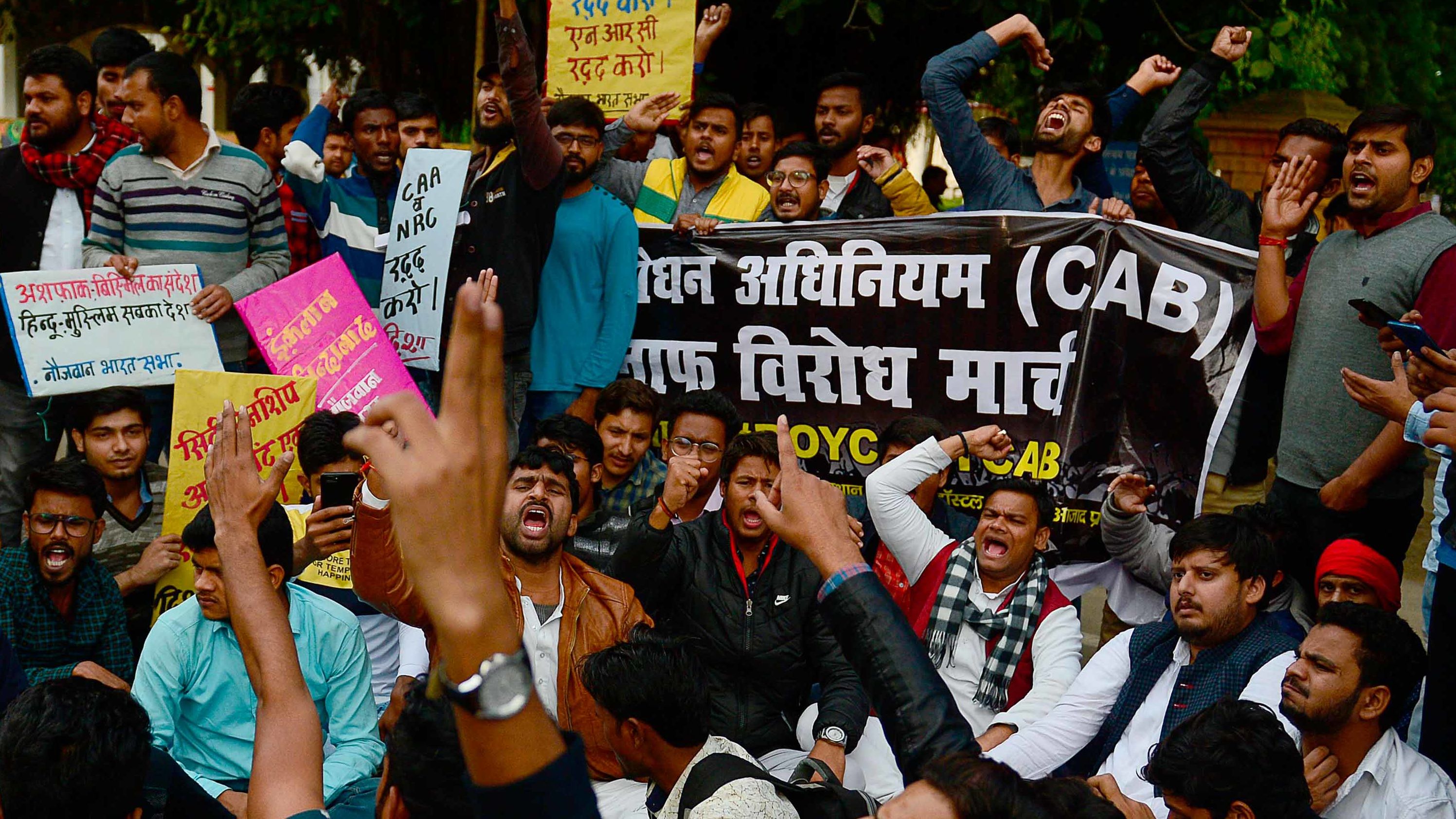 Students and activists protest outside the Allahabad University campus in Allahabad, India, on Monday, December 16.