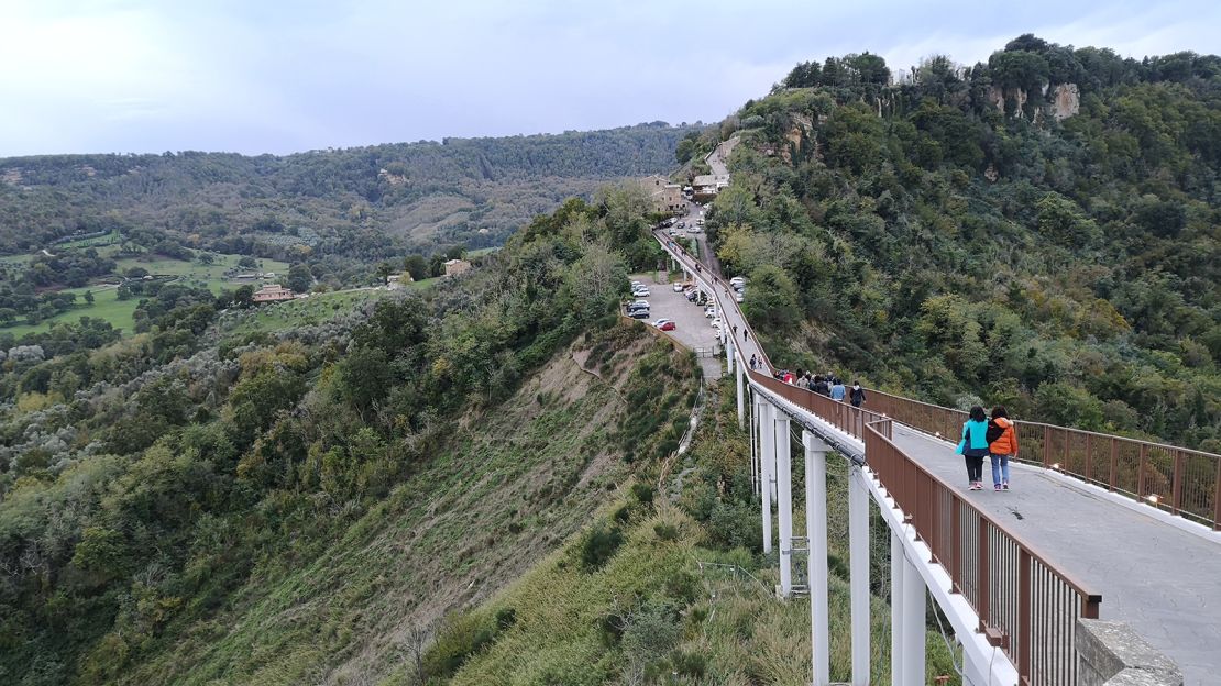 The pedestrian bridge is cantilevered over the badlands