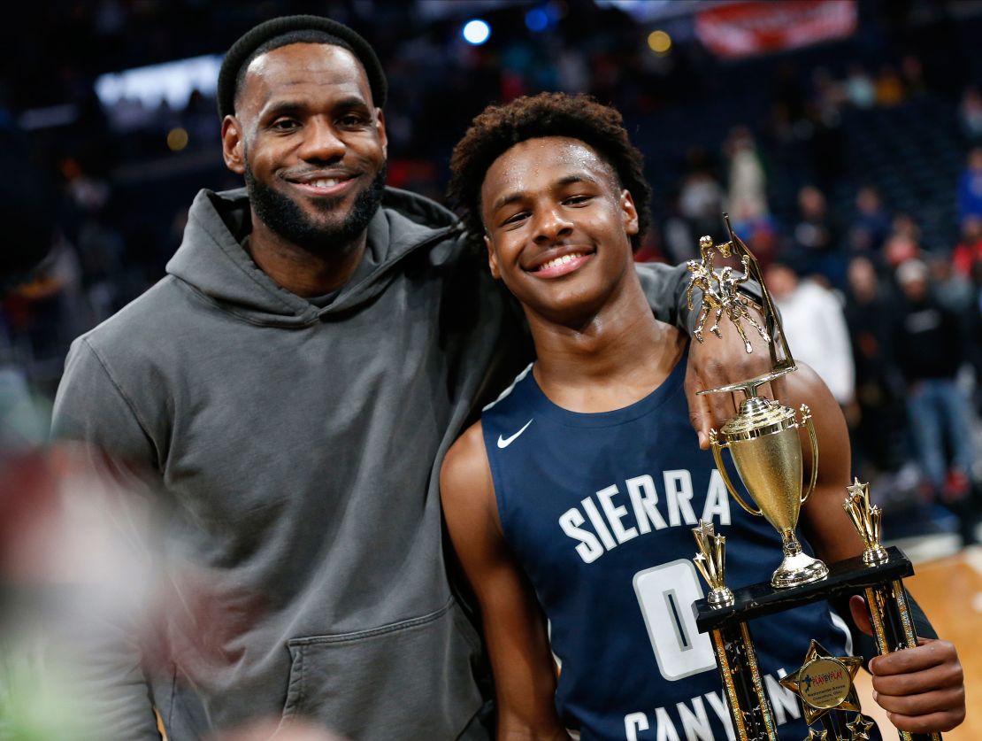 LeBron James, left, poses with his son, LeBron James Jr., also known as Bronny, after Sierra Canyon beat James' alma mater, St. Vincent-St. Mary, on December 14 in Columbus, Ohio.