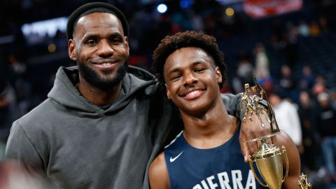 LeBron James, left, poses with his son, LeBron James Jr., also known as Bronny, after Sierra Canyon beat James' alma mater, St. Vincent-St. Mary, on December 14 in Columbus, Ohio.