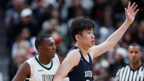 Harold Yu of Sierra Canyon posts up against Marcus Johnson of St. Vincent-St. Mary.