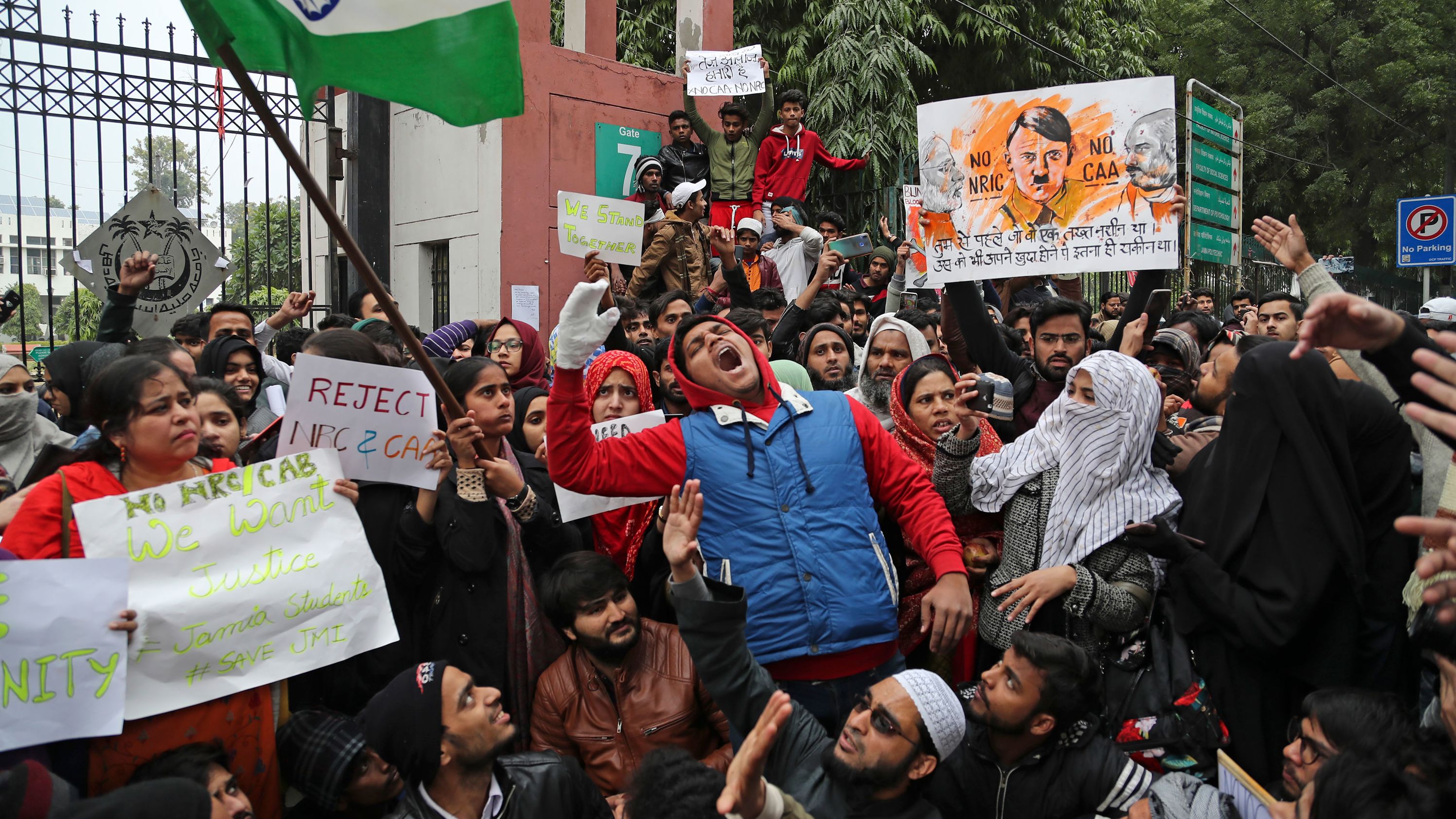 Students from Jamia Millia Islamia, a university in New Delhi, shout slogans during a protest on Tuesday, December 17.