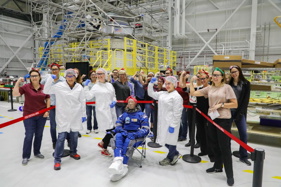 Boeing female workers surrounded Rosie the test dummy to celebrate.