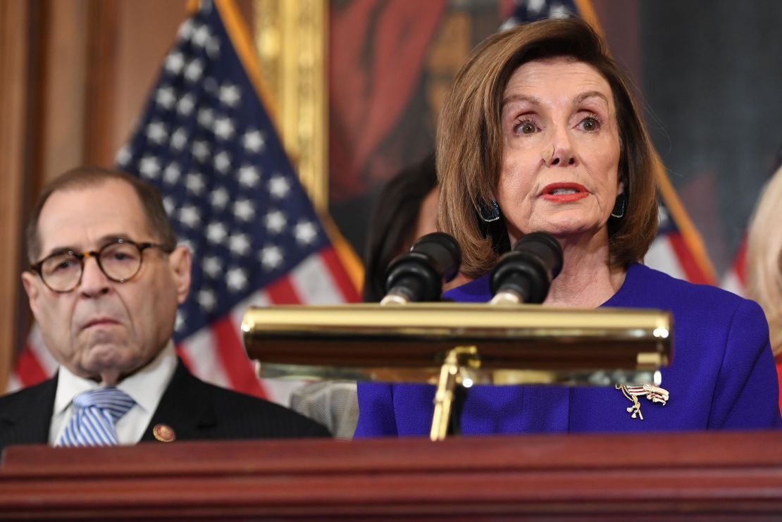 House Speaker Nancy Pelosi next to House Judiciary Chairman Jerry Nadler, Democrat of New York, announces articles of impeachment for US President Donald Trump. 
