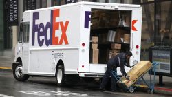 A FedEx worker stacks packages on a cart on December 02, 2019 in San Francisco, California. Cyber Monday shoppers are on track to spend a record $9.4 billion on online purchases, a nearly 19 percent jump from one year ago, following strong Black Friday sales purchases of $7.2 billion.