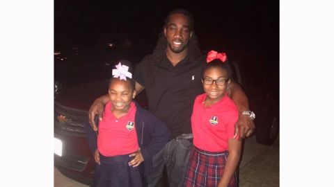 Ryan Matthews with his two daughters, Chassidy (left) and Re'yan (right) before heading to a school book fair