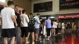 Chinese filmgoers wait inside a cinema to watch Chinese animated film "Ne Zha" in Yichang city, central China's Hubei province, 2 August 2019.