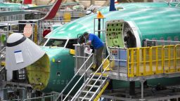 Employees work on Boeing 737 MAX airplanes at the Boeing Renton Factory in Renton, Washington on March 27, 2019. - Embattled aviation giant Boeing will do all it can to prevent future crashes like the two that killed nearly 350 people in recent months, a company official said. Boeing gathered hundreds of pilots and reporters at its factory to unveil a fix to the flight software of its grounded 737 MAX aircraft, which has been implicated in the latest air disasters. (Photo by Jason Redmond / AFP)        (Photo credit should read JASON REDMOND/AFP via Getty Images)