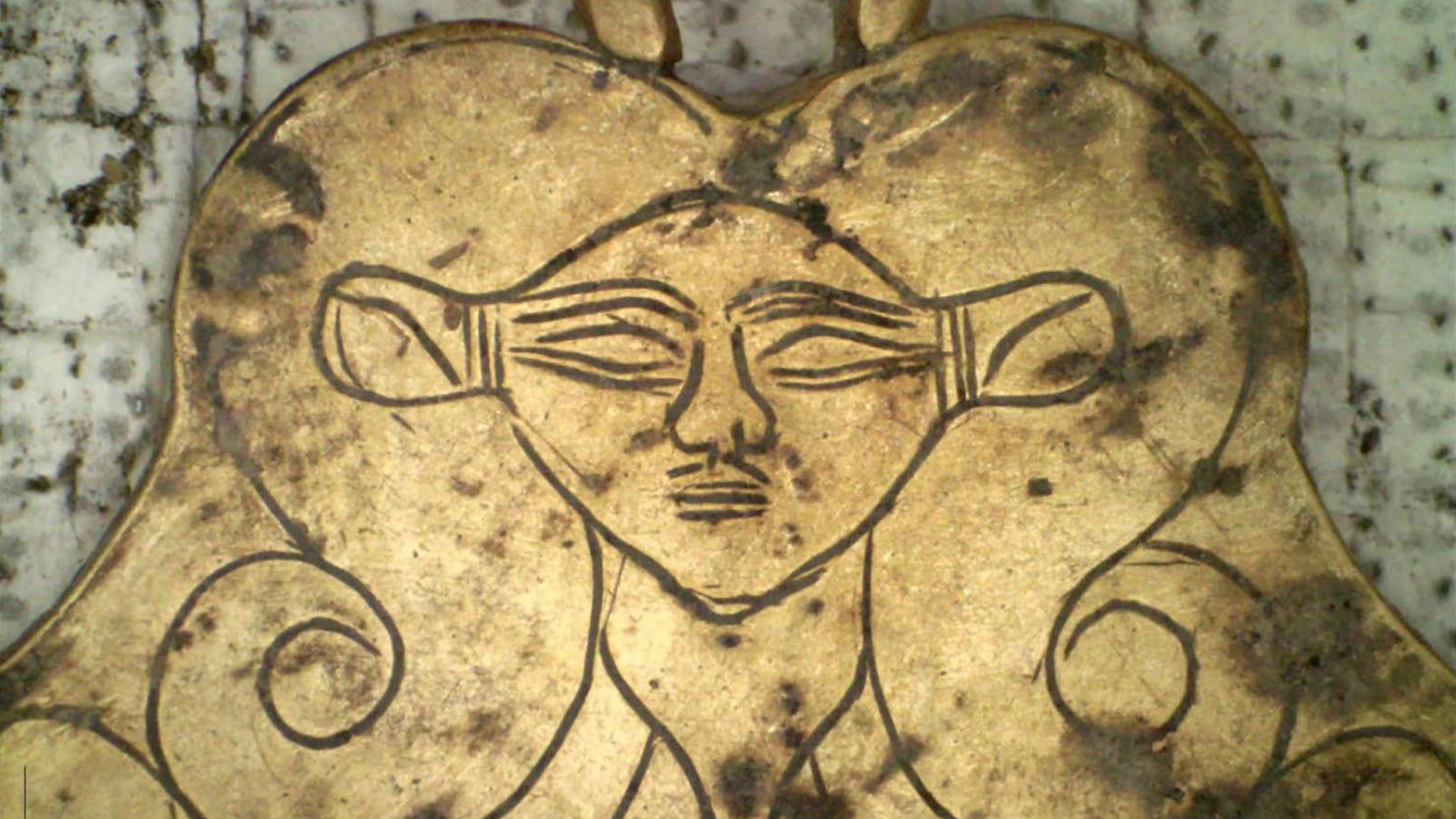 This gold pendant depicting the Egyptian goddess Hathor was discovered in tombs in Pylos by archaeologists from the University of Cincinnati. 
