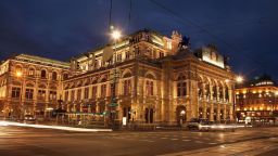 VIENNA, AUSTRIA - FEBRUARY 15:  Cars pass the illuminated Vienna Opera house, on February 15, 2007, Vienna, Austria. The Vienna Opera Ball will take place there this evening.  (Photo by Johannes Simon/Getty Images)