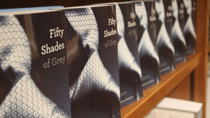 Who is the author of the best-selling erotic romance novels in the fifty shades trilogy?