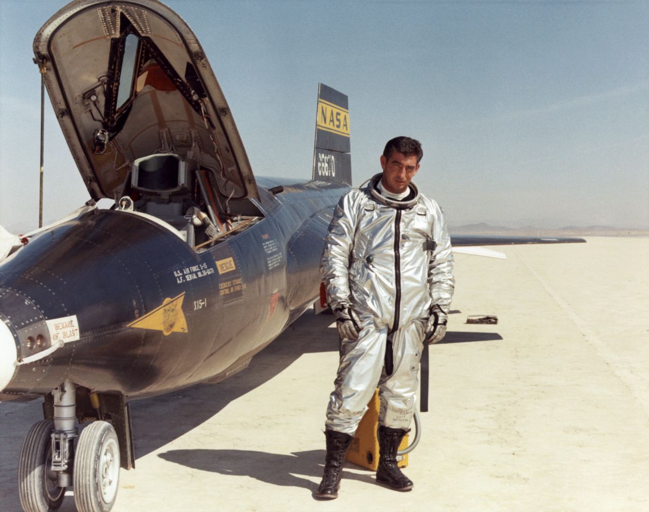 Air Force test pilot Maj. Michael J. Adams stands beside X-15 ship number one. 