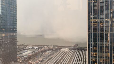 A snow squall moves across the Hudson River towards Manhattan on December 18, 2019.