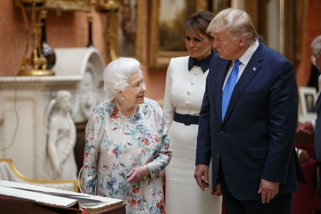 The Queen Elizabeth II views displays of US items of the Royal collection at Buckingham Palace on June 3 with US President Donald Trump and first lady Melania Trump. 