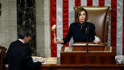 House Speaker Nancy Pelosi of Calif., strikes the gavel after announcing the passage of article II of impeachment against President Donald Trump, Wednesday, Dec. 18, 2019, on Capitol Hill in Washington. 