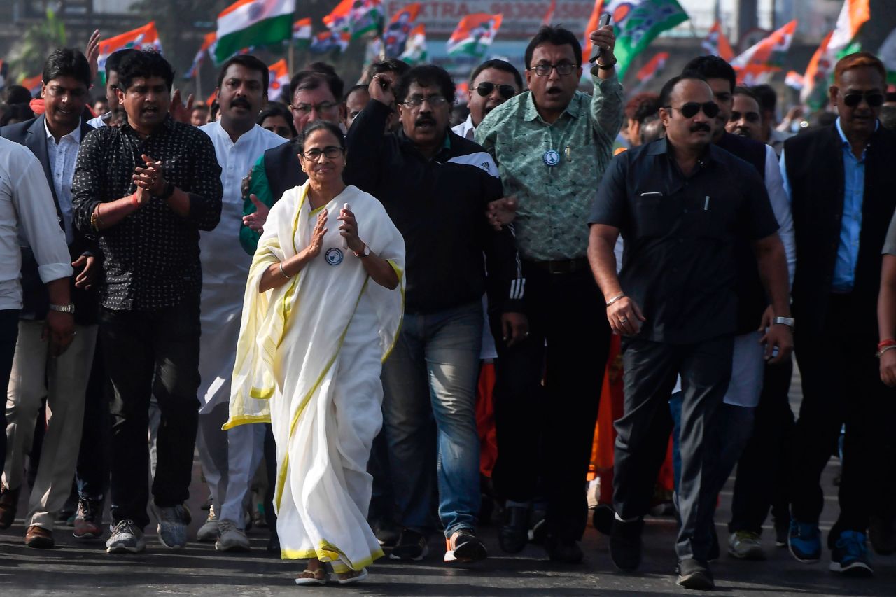 Chief minister of West Bengal state and leader of the Trinamool Congress Mamata Banerjee, along with party supporters, walks in a mass rally across Howrah bridge in Kolkata on December 18.