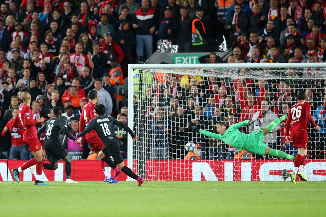 Minamino scores his side's second goal against Liverpool in the Champions League.