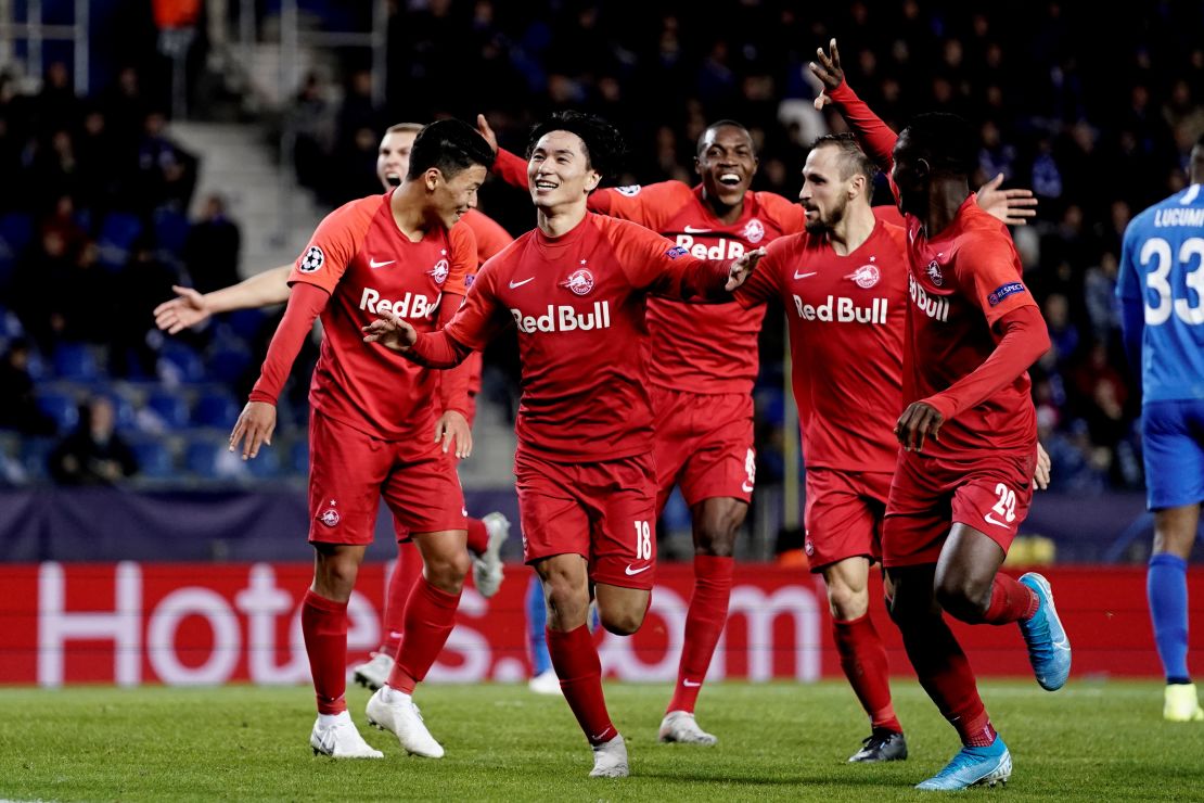 Minamino celebrates after scoring against KRC Genk.