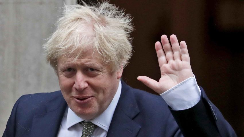 Britain's Prime Minister Boris Johnson waves as he leaves Downing Street for the State Opening of Parliament by Queen Elizabeth II, in the House of Lords at the Palace of Westminster in London, Thursday, Dec. 19, 2019.(AP Photo/Frank Augstein)