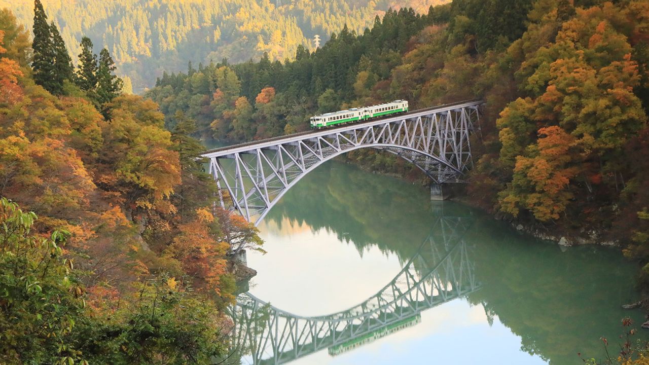 The scenic Tadami Line, seen here from Mishima's No. 1 Tadami River Bridge Viewpoint, travels 84 miles from Aizuwakamatsu to Koide in Niigata Prefecture. 
