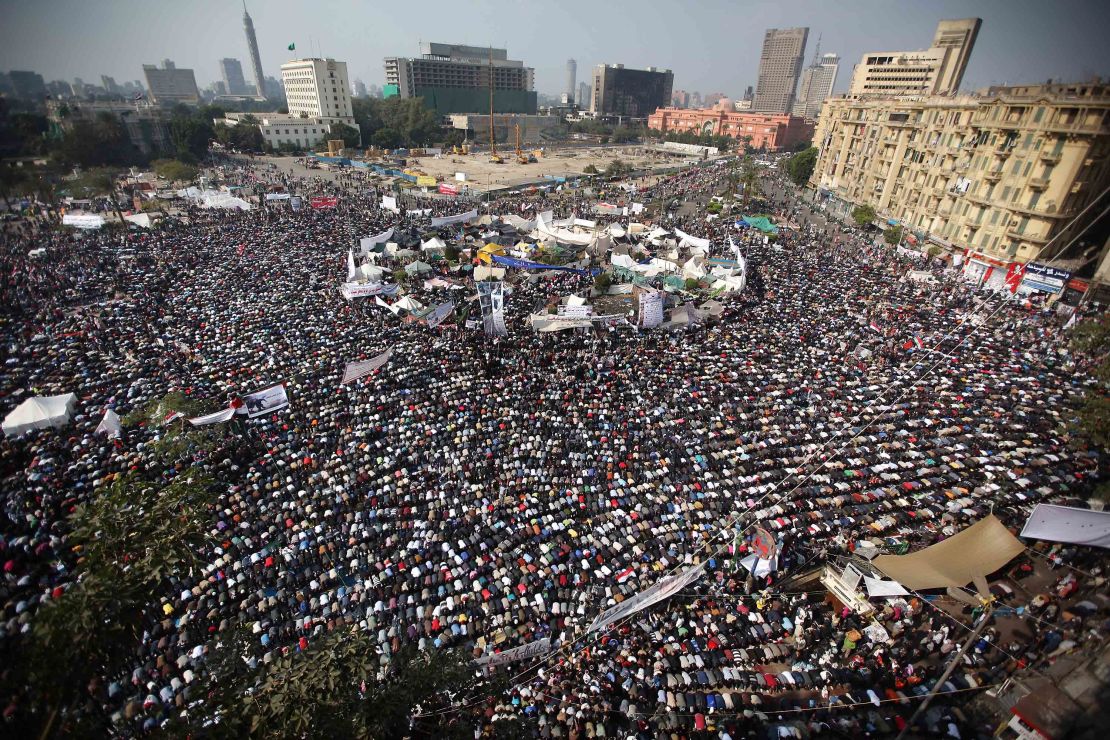 People take part in Friday prayers in Cairo's Tahrir Square before a mass rally in November 2011.
