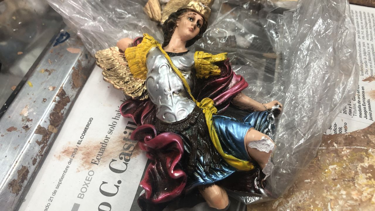 Some of the figurines are chipped and discolored, while others are burnt and sooty. Most look as if they barely escaped a freak accident.
